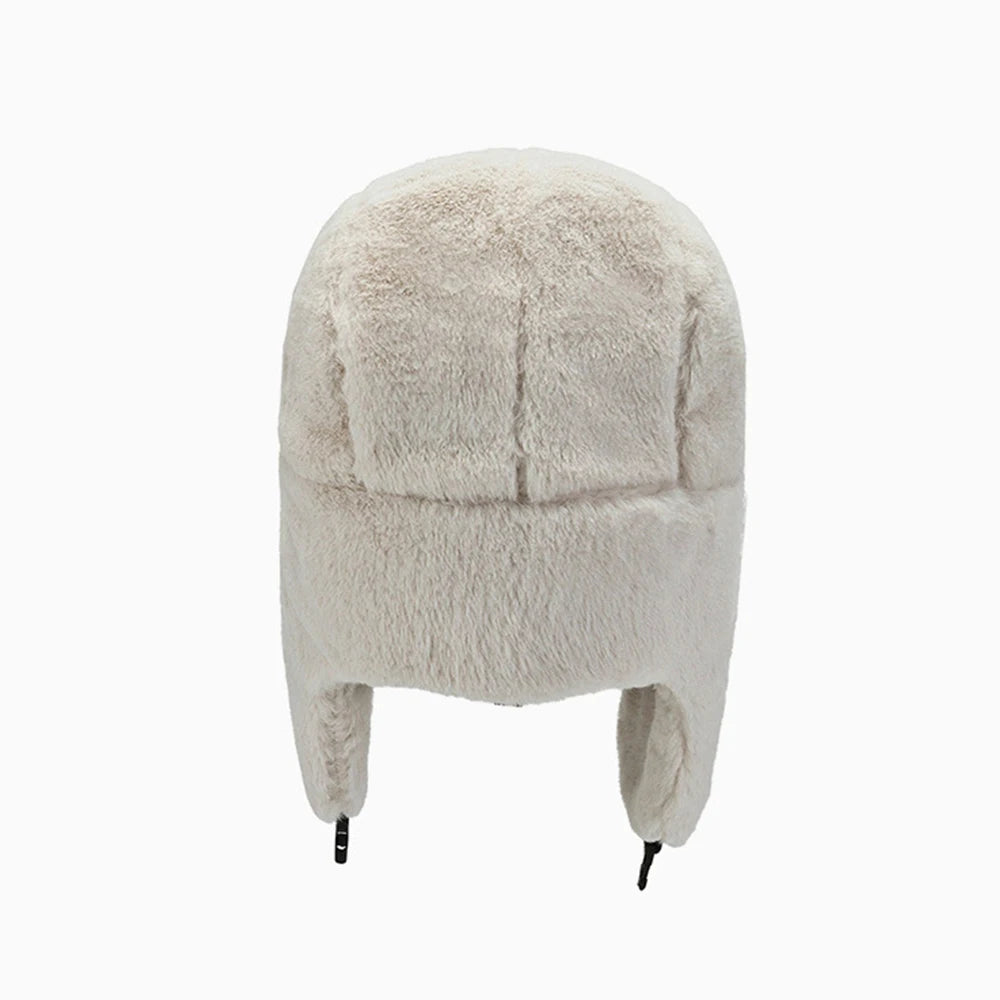 A light beige classic Russian Ushanka trapper hat with a thick fur lining.