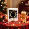 A white magnetic vinyl record player night light with interchangeable discs sits on a red plaid tablecloth surrounded by fest