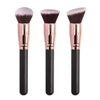 Three professional makeup brushes with pink bristles and gold ferrules shown against a white background.