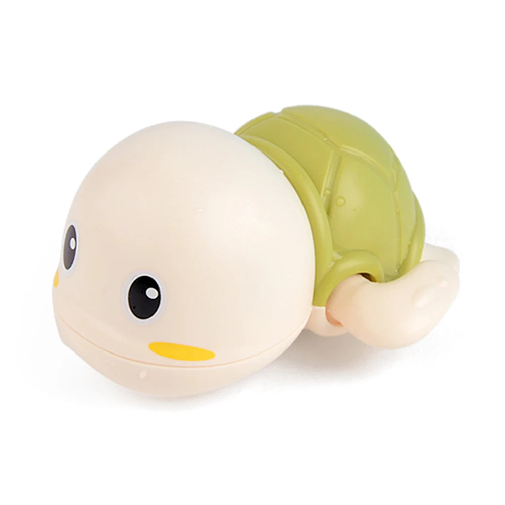 A light beige cartoon monkey water spray bath toy with a green shell.