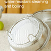 A stainless steel triangle bracket steamer basket is shown resting on a light surface.