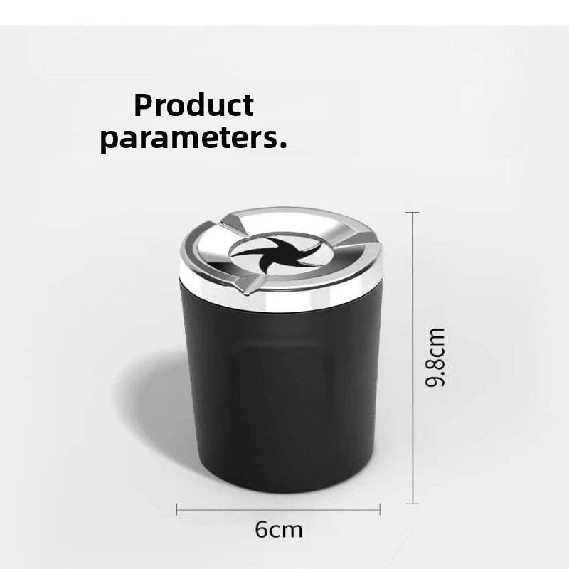 A black car ashtray with a silver flip lid and a heatproof ceramic liner, shown from the side.