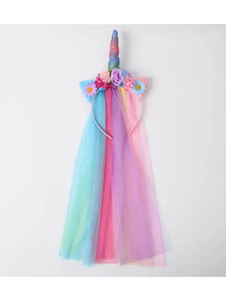 A colorful unicorn mesh headband featuring pink, blue, and purple tulle with floral accents.