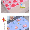 Pink and white cartoon design mattress protector featuring rabbit motifs for a baby