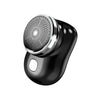 A close-up view of a black electric shaver with a mesh head and silver accents.