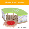 A wooden model of a Green Roof station featuring an entrance and a red platform.