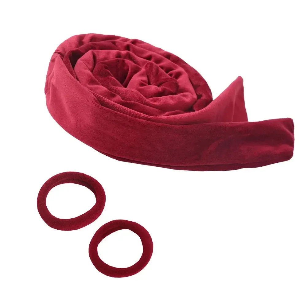 A deep red velvet heatless curling rod headband rolled up and two separate elastic bands are shown.