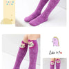 Purple knee-high socks for kids featuring cute cartoon animal designs on the foot and leg