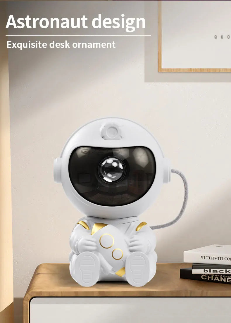 A white astronaut design desk ornament featuring a spherical visor and detailed suit, displayed on a wooden surface.