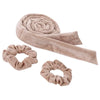 A beige heatless curling rod headband rolled into a spiral and a separate looped band.