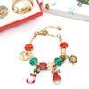 Gold charm bracelet featuring Christmas-themed beads and charms for a 24-day countdown calendar