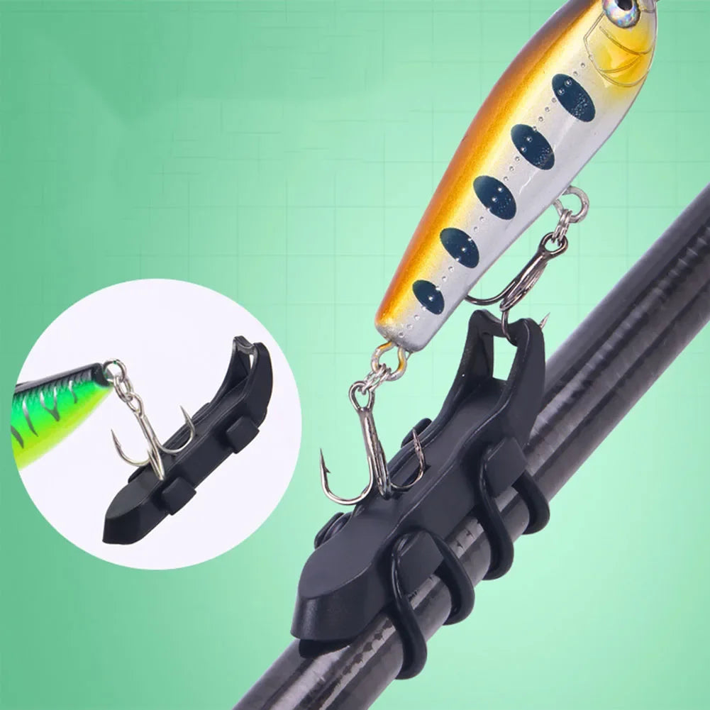 A close-up of a magnetic bait hanger with a non-slip rubber pad attached to a fishing rod.