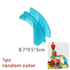 A translucent blue plastic marble run building block set with tracks and funnels