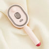 A pink ionic steam hair brush with a smooth body and a red tip is shown against a light background.