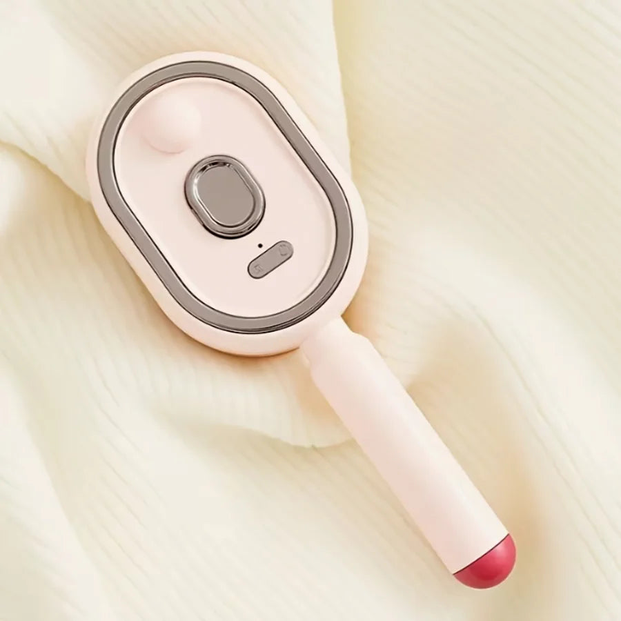 A pink ionic steam hair brush with a smooth body and a red tip is shown against a light background.