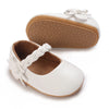 White soft non-slip baby first walker shoes with woven detail and tan sole