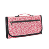 A pink and black leopard print portable waterproof baby changing pad with a carrying handle.