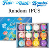 A box of random bath bombs containing various colored fizzies and bath bombs for kids and adults.