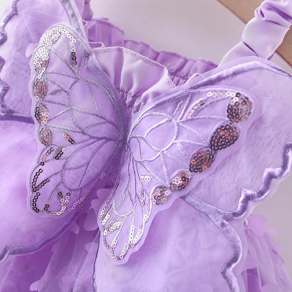Purple sheer butterfly dress with lace detailing and sparkly embellishments