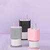 A set of two silicone charger protectors and cable organizers in gray and pink colors.