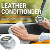 Hand applying Mink Oil leather conditioner balm to a car seat interior.