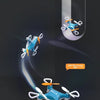 A blue mini drone performing a stunt roll on a dark surface.