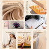 A portable heated shawl and wearable electric blanket in beige fabric shown being used for warmth.