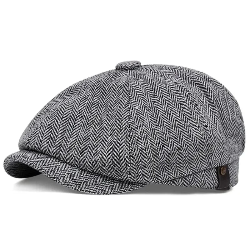 A grey and black patterned vintage newsboy cap or octagonal beret shown from the side.
