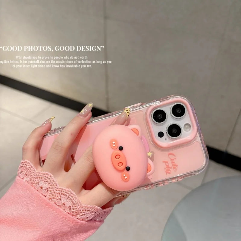 Una mano sostiene un soporte magnético para teléfono con forma de cerdito rosa 3D en un smartphone.