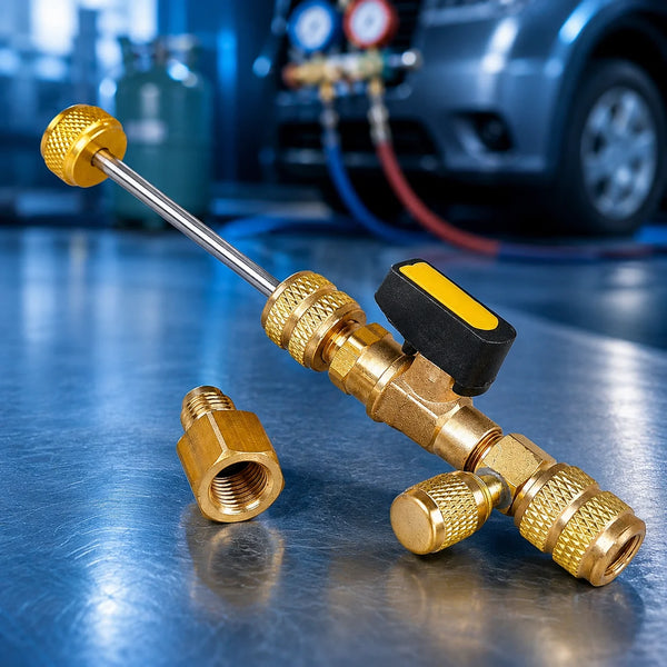 A brass valve core remover and installer kit with a long metal rod and various components resting on a blue surface.