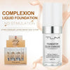A bottle of TLM complexion liquid foundation with a silver cap and packaging box is shown on a pink fabric background.