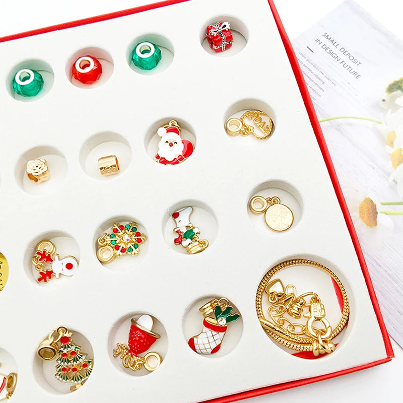 A white advent calendar box filled with small charm bracelets and jewelry for a 24-day Christmas countdown.