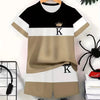 A beige and black colorblock short sleeve t-shirt and shorts set displayed on a hanger.