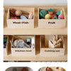 Wooden pretend play food cutting set featuring meat fish fruit kitchen tools and bakery items in wooden trays