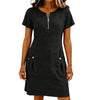 A woman wearing a black lightweight cotton-linen short sleeve dress with a collar and front zipper and side pockets.