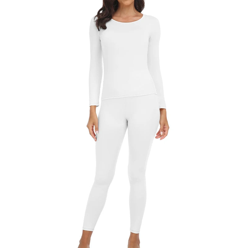 A woman wearing a white long-sleeved thermal top and matching leggings.