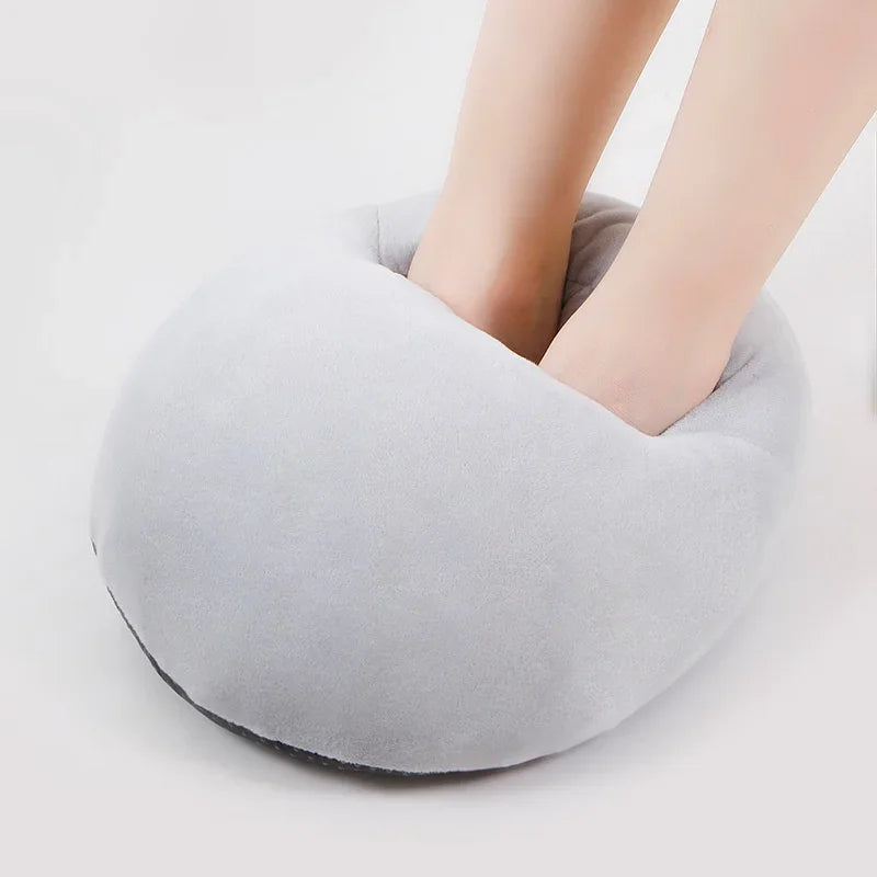A gray cozy USB heated foot warmer with a soft fleece cover placed on a white surface.
