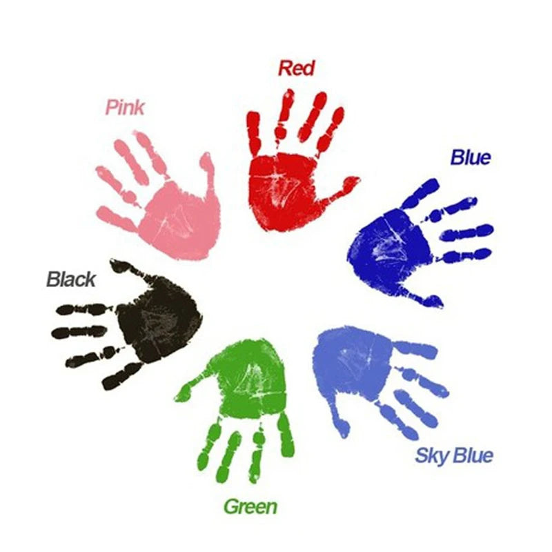A circular arrangement of handprints in various colors including red, pink, black, green, blue, and sky blue.
