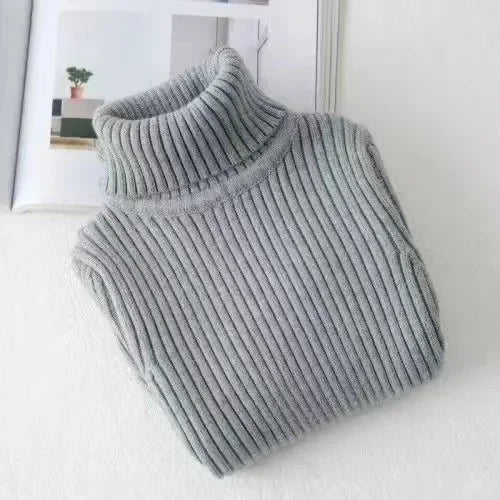 A light gray knit turtleneck sweater for kids displayed on a white surface.