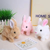 Three fluffy bunny plush toys in brown pink and white are displayed on a light surface.