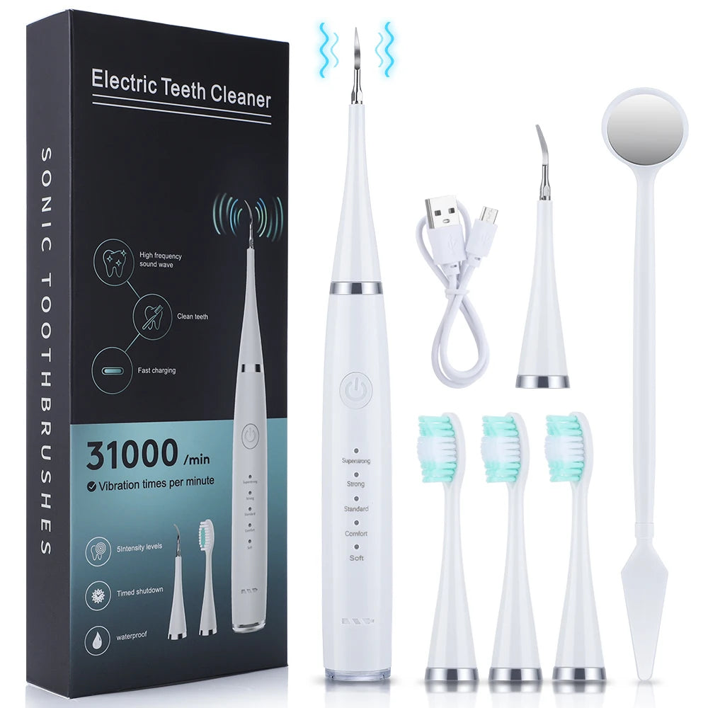 Caja y componentes de un kit de cepillo de dientes sónico: cepillo principal, raspador y herramientas de limpieza.