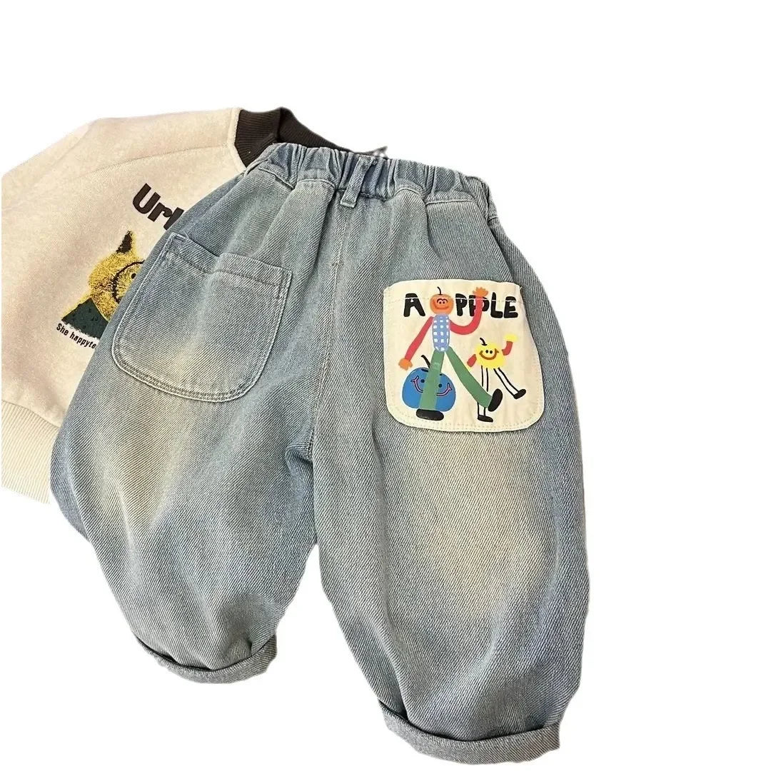 Light blue denim casual straight-leg jeans for boys with an elastic waist and a patch featuring fruit characters.
