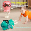 A pink developmental toy shaped like a jellyfish guide for crawling limbs next to a teal electronic toy.
