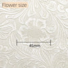 Close-up of vintage floral textured faux leather fabric showing a flower size measurement of 45mm