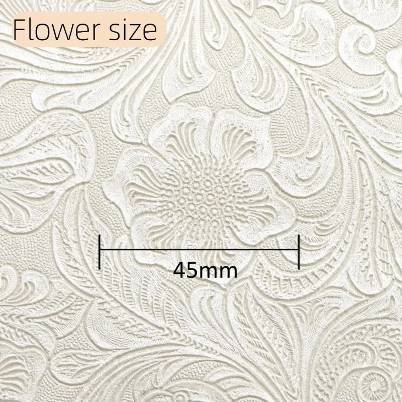 Close-up of vintage floral textured faux leather fabric showing a flower size measurement of 45mm