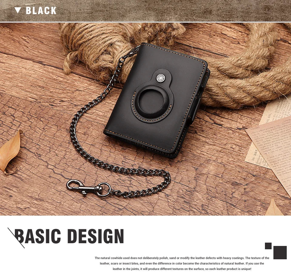 A black Crazy Horse leather smart wallet with a chain attached, resting on a wooden surface.