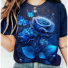 A dark blue t-shirt featuring a vibrant floral print of blue roses and butterflies.