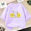 Light purple kids t-shirt featuring a graphic design of a bicycle with orange slices.