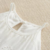 White cotton suspenders dress for a toddler girl shown from the front