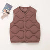 A solid mauve quilted vest for a child, displayed next to a small stuffed animal.
